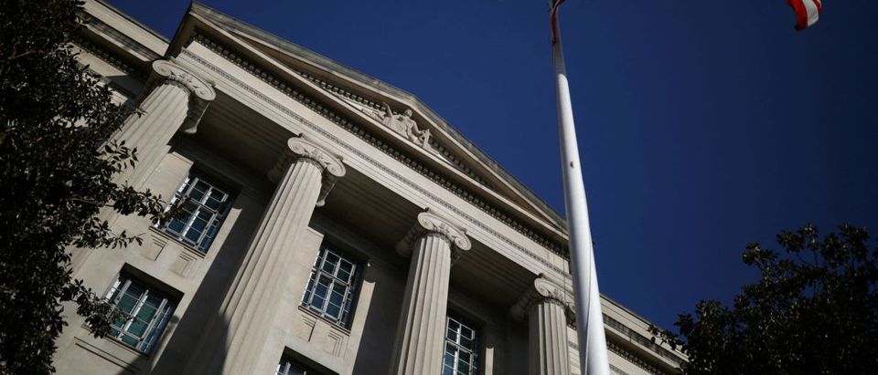FILE PHOTO: American flag waves outside the U.S. Department of Justice Building in Washington