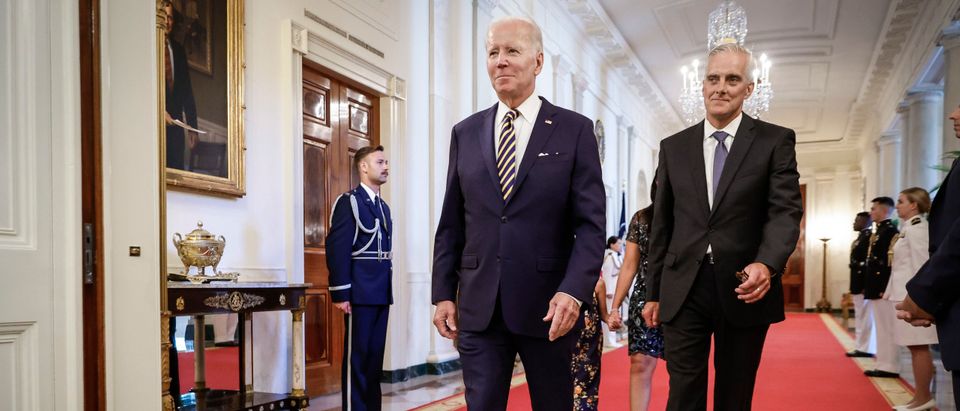 WASHINGTON, DC - AUGUST 10: (L-R) U.S. President Joe Biden and Secretary of Veterans Affairs Denis McDonough walk through the Cross Hall to the East Room for a signing ceremony for The PACT Act at the White House August 10, 2022 in Washington, DC. (Photo by Chip Somodevilla/Getty Images)