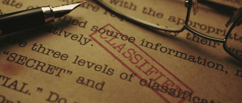 Close up of classified documents [Shutterstock alexskopje]