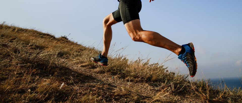 Dynamic,Running,Uphill,On,Trail,Male,Athlete,Runner,Side,View