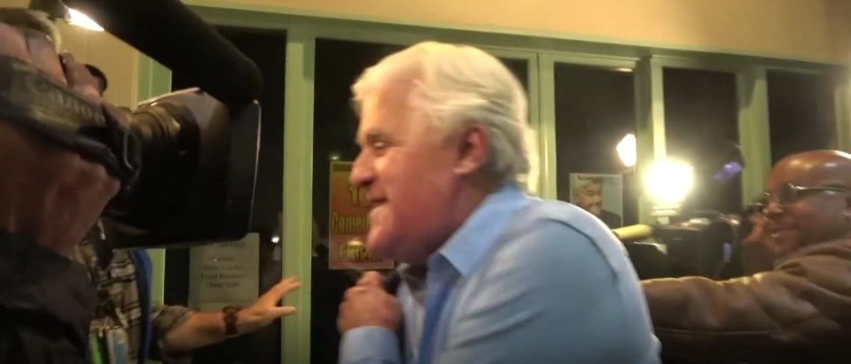 Jay Leno arrives to comedy club to perform live on stage two weeks after suffering third degree burns to his face in a car fire, TMZ