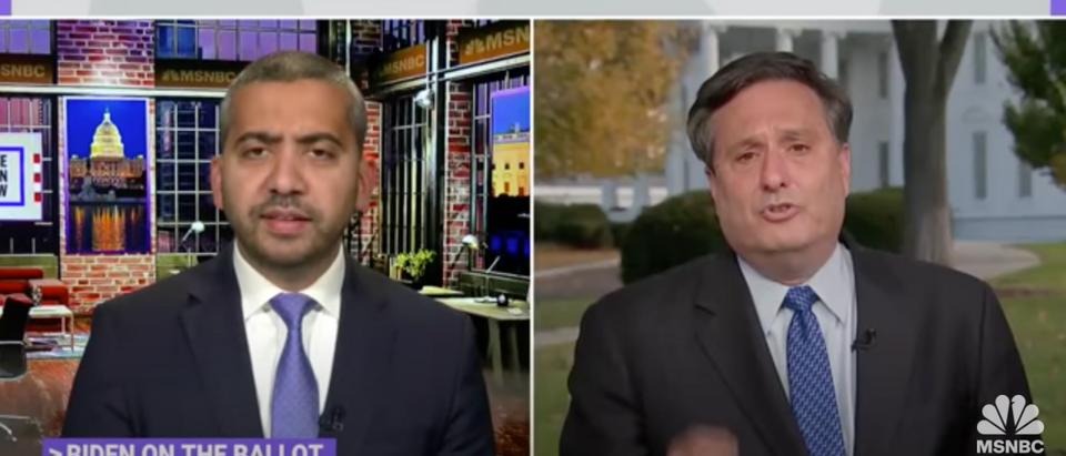 MSNBC's Mehdi Hasan and White House Chief of Staff Ron Klain duked it out Tuesday night about President Joe Biden's comments about the pandemic. [Screenshot MSNBC Youtube]