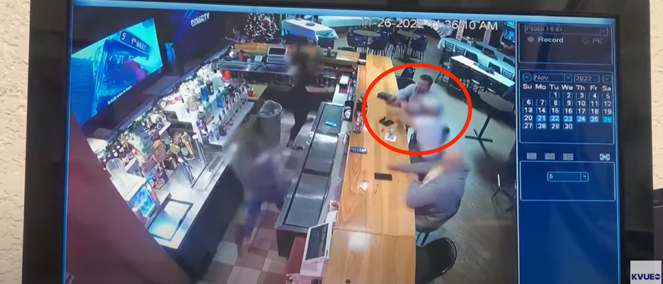 Surveillance footage shows the moment a bunch of customers tackled a man - who has since been released on bond - who whipped out a gun on his ex-girlfriend while she was bartending. [Screenshot Youtube KVUE]