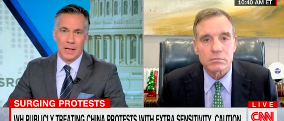 Democratic Virginia Sen. Mark Warner appeared to suggest Tuesday that the Biden administration is scared of ruffling China's feathers amid mass protests in the communist nation. [Screenshot CNN]