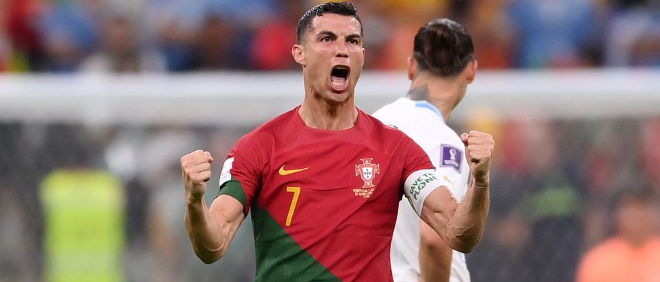 Cristiano Ronaldo of Portugal celebrates their team's first goal by Bruno Fernandes during the FIFA World Cup Qatar 2022 Group H match between Portugal and Uruguay at Lusail Stadium on November 28, 2022 in Lusail City, Qatar. (Photo by Laurence Griffiths/Getty Images)