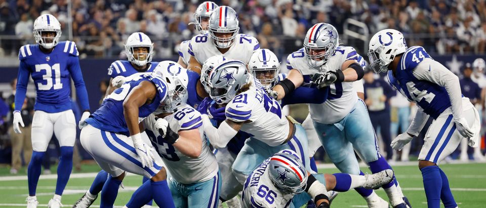 Ezekiel Elliott #21 of the Dallas Cowboys scores a touchdown in the fourth quarter of a game against the Indianapolis Colts at AT&T Stadium on December 04, 2022 in Arlington, Texas. (Photo by Wesley Hitt/Getty Images)
