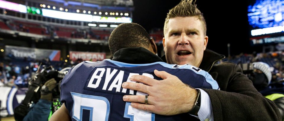 Safety Kevin Byard #31 of the Tennessee Titans is embraced by General manger Jon Robinson following the Titans win over the Jaguars at Nissan Stadium on December 31, 2017 in Nashville, Tennessee. (Photo by Shaban Athuman/Getty Images)