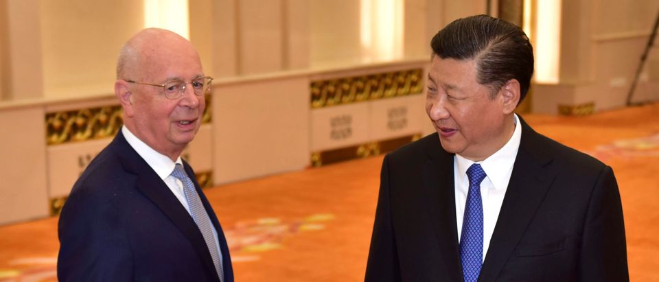 BEIJING, CHINA - APRIL 16: Klaus Schwab, Founder and Executive Chairman of the World Economic Forum, (L) chats with Chinese President Xi Jinping before their meeting at the Great Hall of the People on April, 16 in Beijing, China.(Photo by Naohiko Hatta-Pool/Getty Images)
