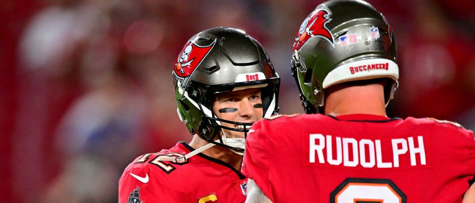 Tampa Bay Buccaneers quarterback Tom Brady (12) puts on his helmet