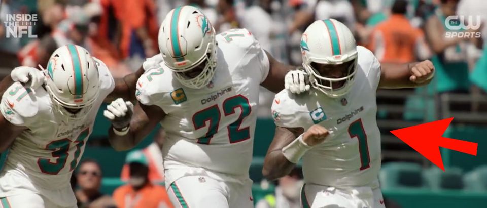 The Miami Dolphins celebrate after scoring a touchdown during the