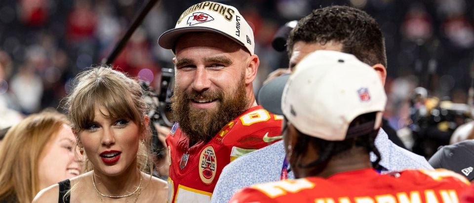 LAS VEGAS, NEVADA - FEBRUARY 11: Travis Kelce #87 of the Kansas City Chiefs and Taylor Swift react as they see Mecole Hardman Jr. #12 of the Kansas City Chiefs following the NFL Super Bowl 58 football game between the San Francisco 49ers and the Kansas City Chiefs at Allegiant Stadium on February 11, 2024 in Las Vegas, Nevada. (Photo by Michael Owens/Getty Images)