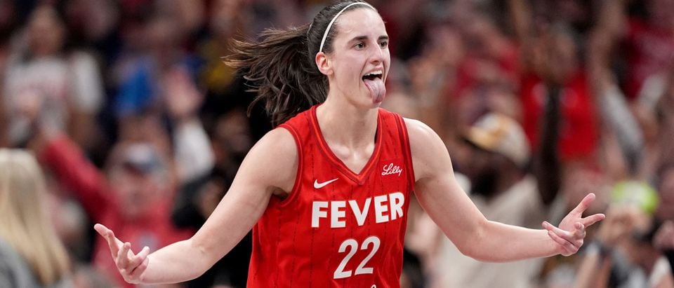 INDIANAPOLIS, INDIANA - SEPTEMBER 13: Caitlin Clark #22 of the Indiana Fever celebrates a basket during the second half of a game against the Las Vegas Aces at Gainbridge Fieldhouse on September 13, 2024 in Indianapolis, Indiana. NOTE TO USER: User expressly acknowledges and agrees that, by downloading and or using this photograph, User is consenting to the terms and conditions of the Getty Images License Agreement. (Photo by Emilee Chinn/Getty Images)